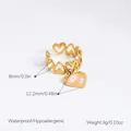 Bague cœur dorée avec pendentif œil rose en acier inoxydable étanche pour femmes à la mode - Pendentif Coeur Mauvais Oeil Rose-Bande Coeur Ajourée