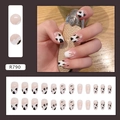 Macro detail of French almond press-on nails featuring cow print and white drip designs - Flowing Milk Design (R790)