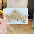 Handmade butterfly hair clip with amber crystals on a golden alloy spring base - Champagne