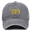 Close-up of TTPD yellow embroidery on a gray washed vintage style baseball cap - One Size / Gray