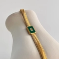 Close-up of 18k gold plated snake chain bracelet with green malachite pendant and zircon - Green Bracelet
