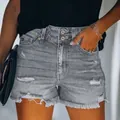 High-waisted distressed denim shorts in washed grey with double buttons and frayed edges - S / Gray