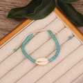 Handmade turquoise bead bracelet featuring a natural white seashell on a woven cord - Style 25-Turquoise Shell Rope Bracelet