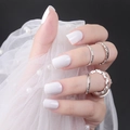 Glossy square press-on nails for kids shown with elegant silver rings on lace fabric - Shiny White (DFL-02)