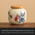 Ceramic tea canister in honey glaze with blue cartoon dragon and Joy calligraphy - Honey Glaze Dragon - Happiness