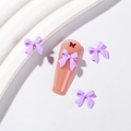 Bijoux d'ongles avec nœuds en résine violette 3D sur faux ongles transparents rose poudré - Violet