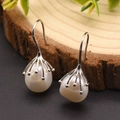 Baroque pearl drop earrings with silver metal hooks on natural wood background - White Irregular Pearl - Sterling Silver
