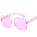 Fashionable pink translucent rimless oversized square sunglasses with a candy color finish - Pink