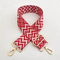 Detail of red and white geometric woven bag strap with golden metal swivel hooks - Red