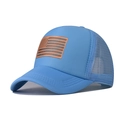 Detail of sky blue trucker hat featuring breathable mesh and laser-engraved US flag leather patch - Sky Blue