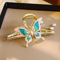 Elegant gold butterfly hair claw with pink enamel details and pearl tassel pendant - Butterfly Enamel Craft Pearl Chain Claw