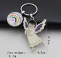Detailed view of enamel angel keychain with Schulkind rainbow charm and 6.1cm size specs - Dark Violet