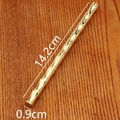 Detailed view of golden bamboo-shaped brass pen on wood background with size markings - Bamboo Pen (Tian Dao Chou Qin) / Gold