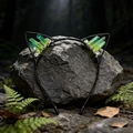Detail of green crystal cat ear headband with black wire frame on a forest rock - Yellow & Green Cat Ears