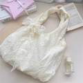 Detailed close-up of cream lace embroidery and floral patterns on the soft fabric handbag - Beige with Apricot Flower