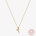 Macro view of gold S925 sterling silver letter T pendant with zircon stone and texture - Gold - Letter T