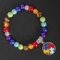 Close-up of rainbow beaded yoga bracelet with autism awareness puzzle heart charm - Style 2 - Round Puzzle Pendant