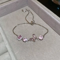 Detail of silver bracelet with pink crystals and butterfly pendant on a velvet tray - No.56 Pink Zircon Bow Knot Combination Bracelet-Silver-Pink