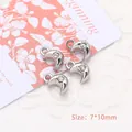 Close-up of 7x10mm silver moon charms with rhinestones for DIY jewelry making - Moon / Silver