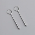 Macro shot of silver metal hoop earrings with elegant vertical bar pendants - Long Bar Earrings (S-E1491) / Silver