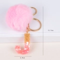 Pink fur ball keychain with gradient glitter letter J and golden metal ring - Letter J