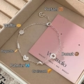 Silver bread charms bracelet featuring pretzels, croissants, and donuts in a jewelry box - Dessert Theme Style (SL1367)