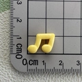 Detailed size measurement of a mini yellow resin music note charm for DIY accessories - Yellow