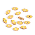 Macro shot of 10mm golden devil eye charms with enamel finish for jewelry making - Eye / Yellow