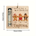Detail of 10cm wooden Christmas money holder featuring three gingerbread men and names - O