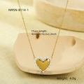 Detail showing gold heart necklace with white pearl on beige ceramic background - Gold Faux Pearl Edge Heart (NMSN-B114-1)