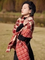 Winter red and beige plaid knit scarf with tassel fringe worn in a sunny park - Woven Christmas Red / Red