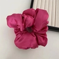Detailed view of large fuchsia satin scrunchie with silk luster and elegant folds - Pearly Satin Rose Red