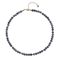 Detail of beaded necklace with gray marble beads, gold spacers, and heart charm extension - Map Stone Necklace
