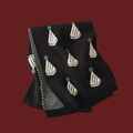 Black knitted scarf featuring white and teal Christmas patterns with ribbed edge finish - Little Hat Black