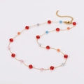 Golden chain necklace featuring multi-colored crystal beads and flower accents - Red Necklace
