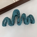 Blue wavy hair claw clip with black abstract line art and a matte finish - Wave Blue