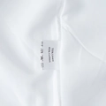 Detailed view of clothing label showing 55% linen and 45% cotton fabric composition - White (Linen Cotton Material)