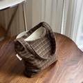 Detail of multi-color striped wool bag featuring simple wish tag and magnetic metal clasp - Green Coffee Stripes