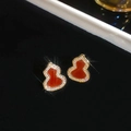 Macro shot of red gourd stud earrings with gold plating and sparkling crystal inlay - 10# Silver Earring Post-Gold Red Agate Gourd