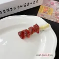 Quirky 6.5cm roasted meat skewer hair clip with realistic resin texture on a white plate - Roasted Beef Skewer