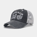 Close-up of distressed baseball cap with mesh back and Barn Hair Don't Care embroidery - Dark Gray with Gray Mesh, Barn Hair, White Horseshoe Style (Color #9)