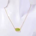 Elegant gold necklace featuring a rectangular green crystal stone pendant on a white bust - August Necklace