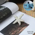 Starfish shaped drawer knob in white gold finish, measuring 8x7.5cm and weighing 95g - Starfish White Gold