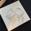 Detail of white translucent flower and faceted crystal pendant on gold hoop earrings - E6146-3/Gold Hoop Crystal Drop