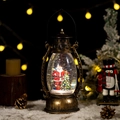 Vintage bronze Christmas lantern music box with Santa Claus scene and swirling snow glitters - Santa Claus & Christmas Tree