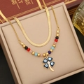 Detail of double-layer gold snake chain featuring a clover evil eye pendant and colored beads - 1# Flower Necklace
