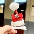 Close-up of red sequin Christmas hat hair clip with white plush pom-pom and silver snowflake - Lamb Fleece 3D Hat Clip - Bowknot
