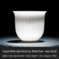 Mutton fat jade tea cup with Heart Sutra relief carving and translucent porcelain finish - Flared Cup [Heart Sutra - Relief]