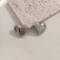 Minimalist silver heart stud earrings with spiral texture on stainless steel surface - Silver