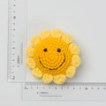 Handmade crochet sunflower keychain accessory with 6.5cm diameter measurement - 7-Ring Smiley Sunflower